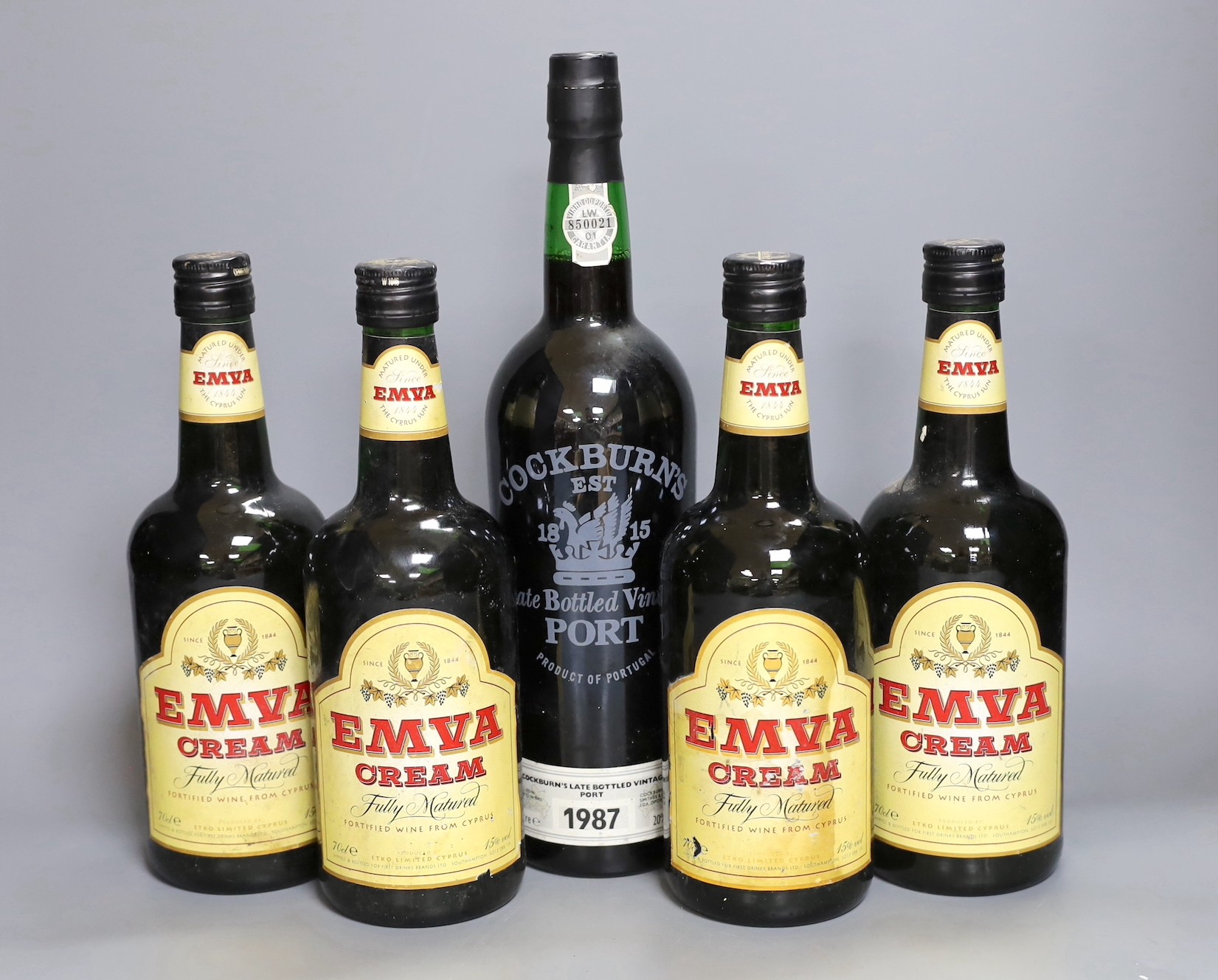 A bottle of Cockburns Vintage Port 1987 together with four bottles of Emva cream sherry